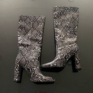 Brand new never worn Steve Madden snake print boots.